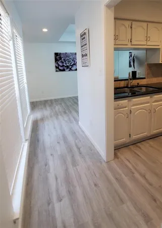 a view of kitchen with wooden floor