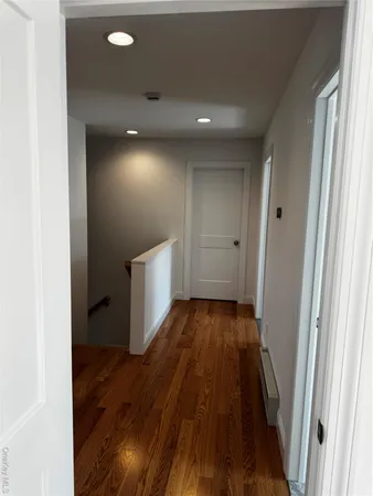 a white toilet sitting next to a shower