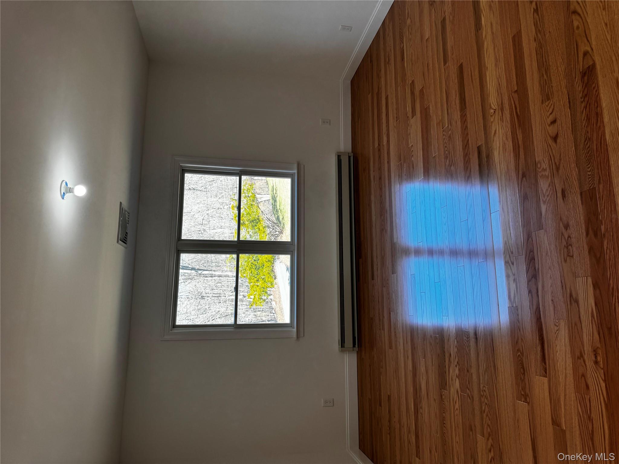 7 Tulip Road Mahopac, NY 10541 - Photo 16 of 32 a view of room with wooden floor and window