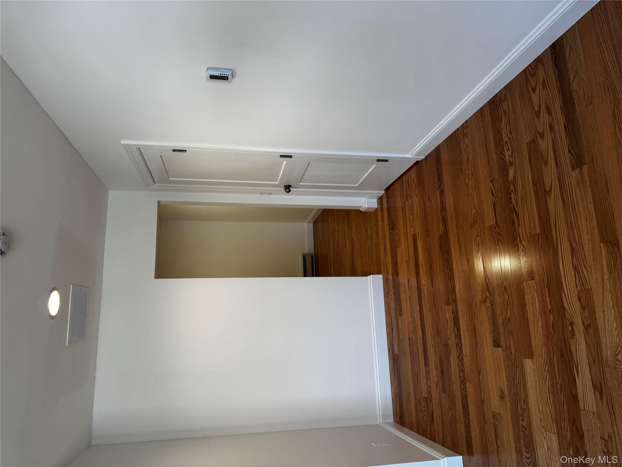 7 Tulip Road Mahopac, NY 10541 - Photo 18 of 32 a view of an empty room with wooden floor and closet