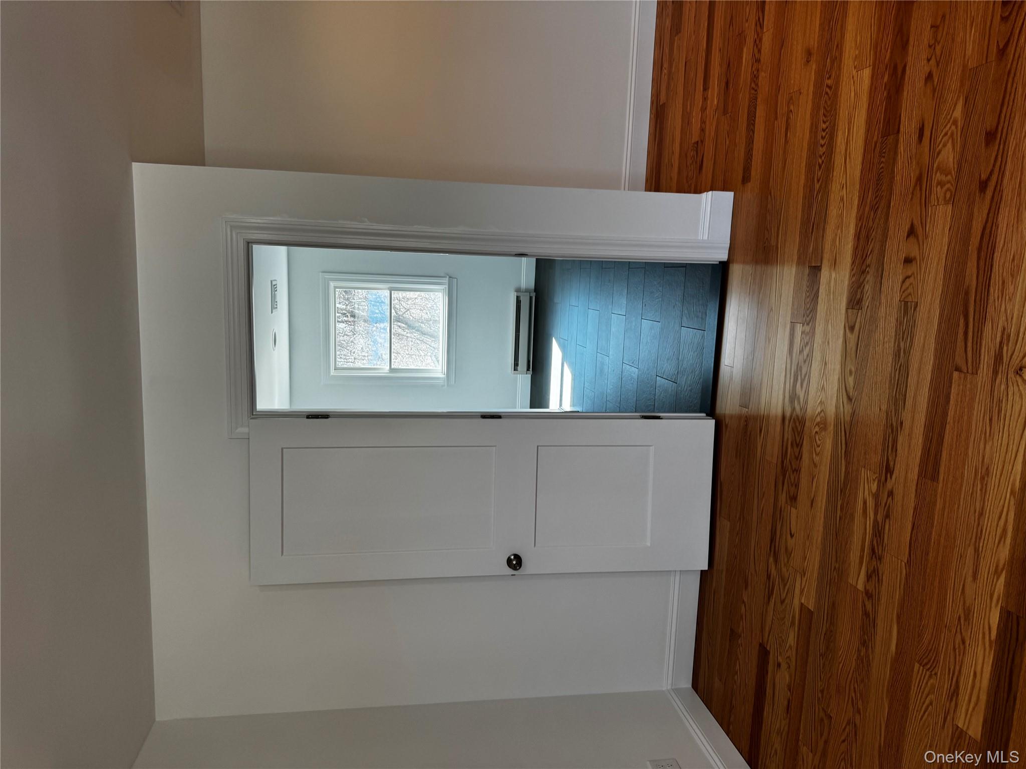 7 Tulip Road Mahopac, NY 10541 - Photo 19 of 32 a view of empty room with wooden floor