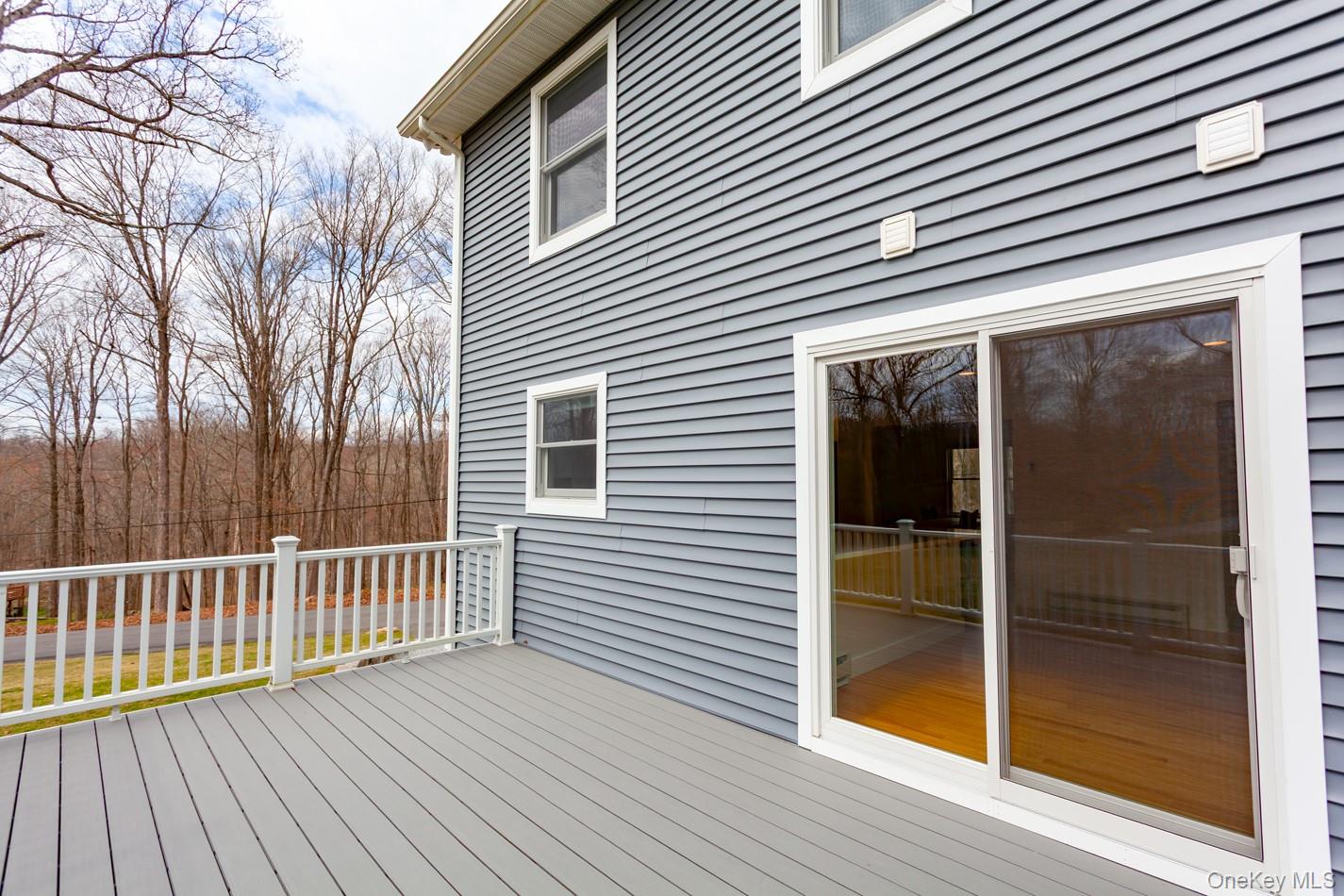 7 Tulip Road Mahopac, NY 10541 - Photo 26 of 29 Deck with sliding window doors access to living room and kitchen