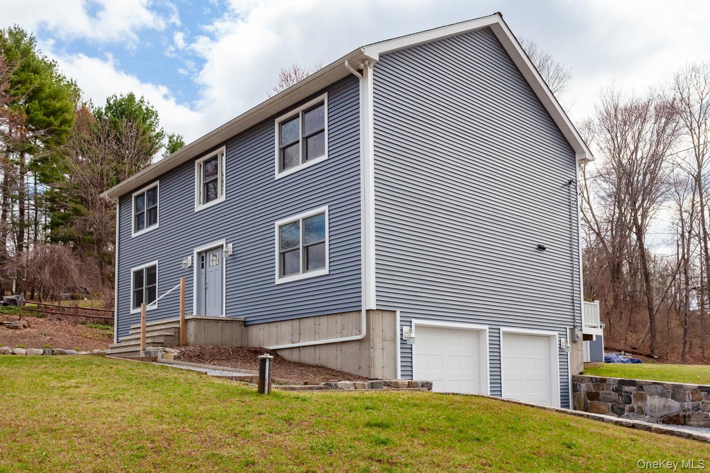 7 Tulip Road Mahopac, NY 10541 - Photo 28 of 29 Front of the house view with garage access from road