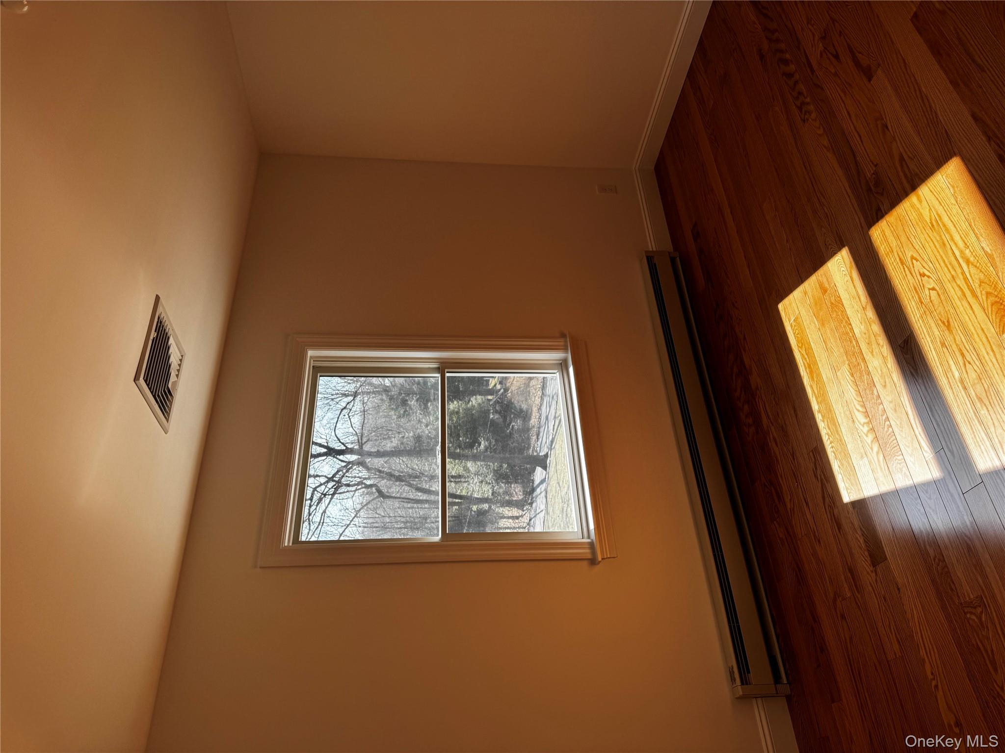 7 Tulip Road Mahopac, NY 10541 - Photo 7 of 32 a view of a room with wooden floor and window