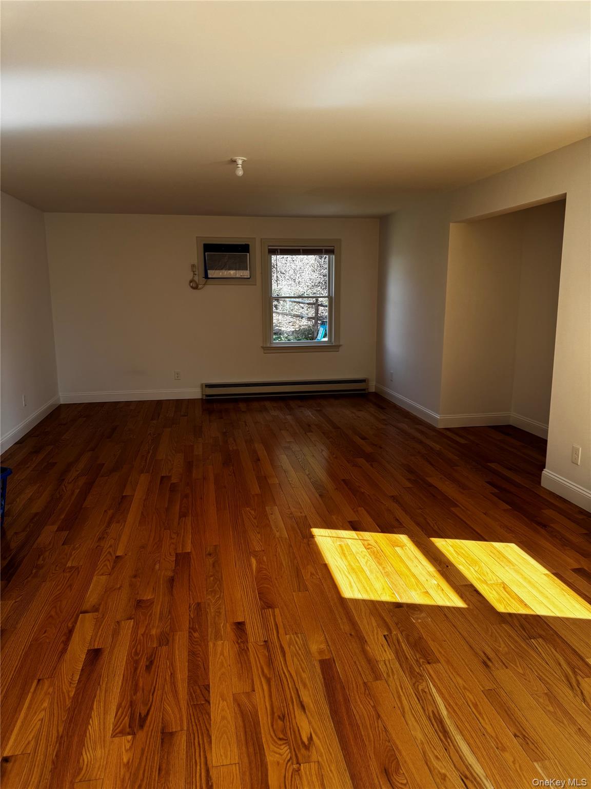 7 Tulip Road Mahopac, NY 10541 - Photo 8 of 32 a view of an empty room and wooden floor