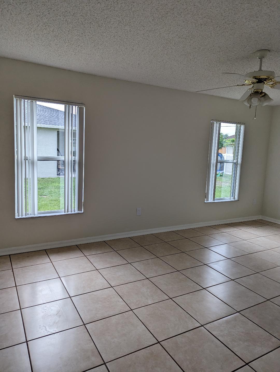 3486 Southwest San Benito Street Port St. Lucie, FL 34953 - Photo 3 of 4 a view of an empty room and window