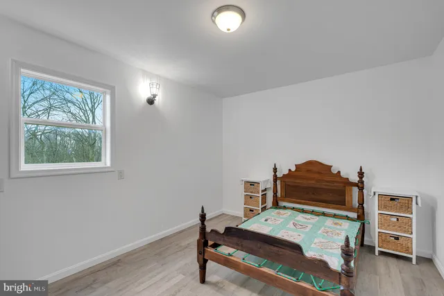a large kitchen with a refrigerator and a stove