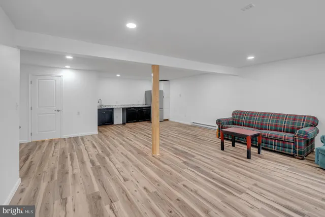 a bathroom with a sink mirror and toilet