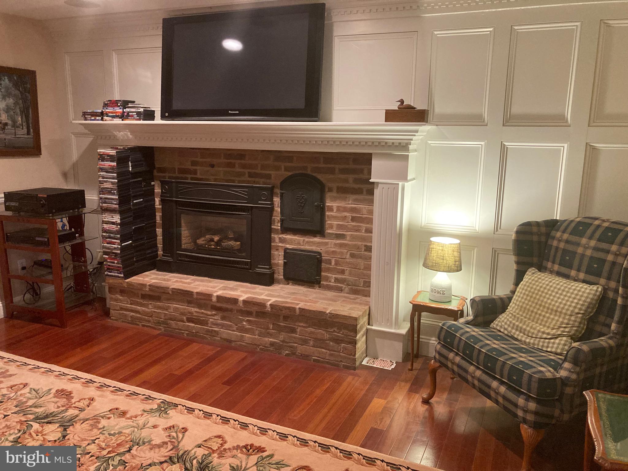 8124 Cromwell Church Road Hustontown, PA 17229 - Photo 11 of 61 a living room with furniture and a fireplace
