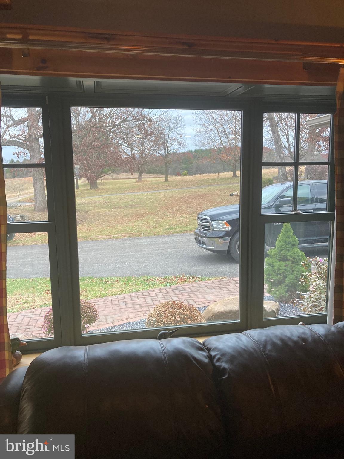 8124 Cromwell Church Road Hustontown, PA 17229 - Photo 13 of 61 a living room with a large window and a bed