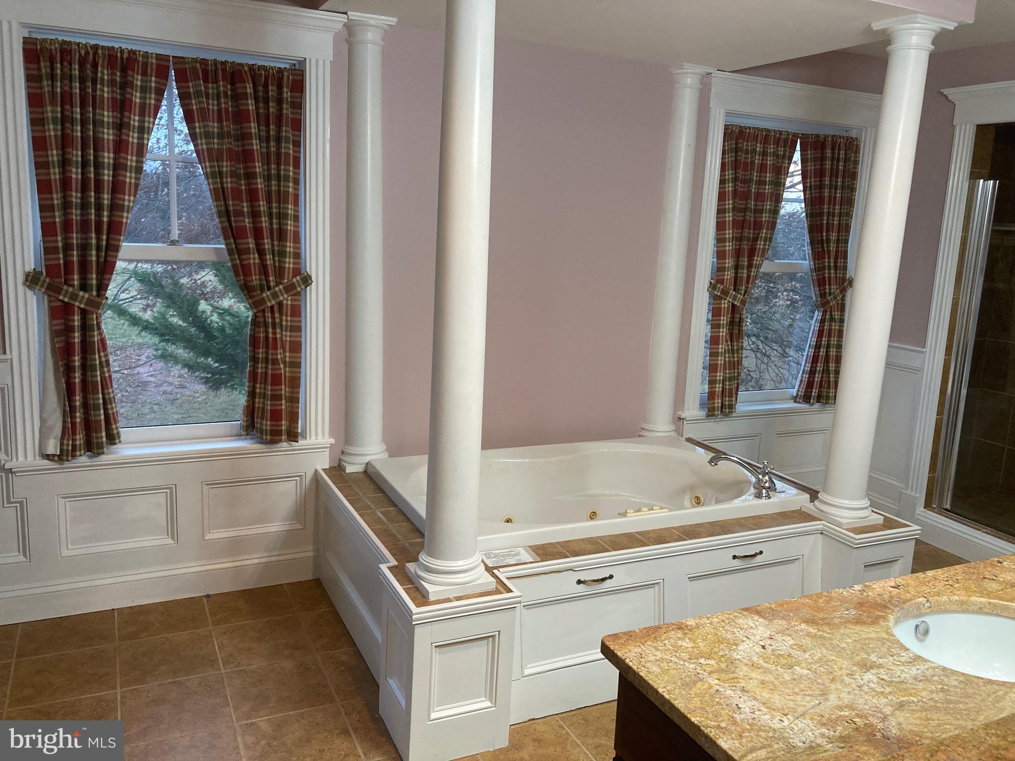 8124 Cromwell Church Road Hustontown, PA 17229 - Photo 25 of 61 a bathroom with a tub sink and mirror
