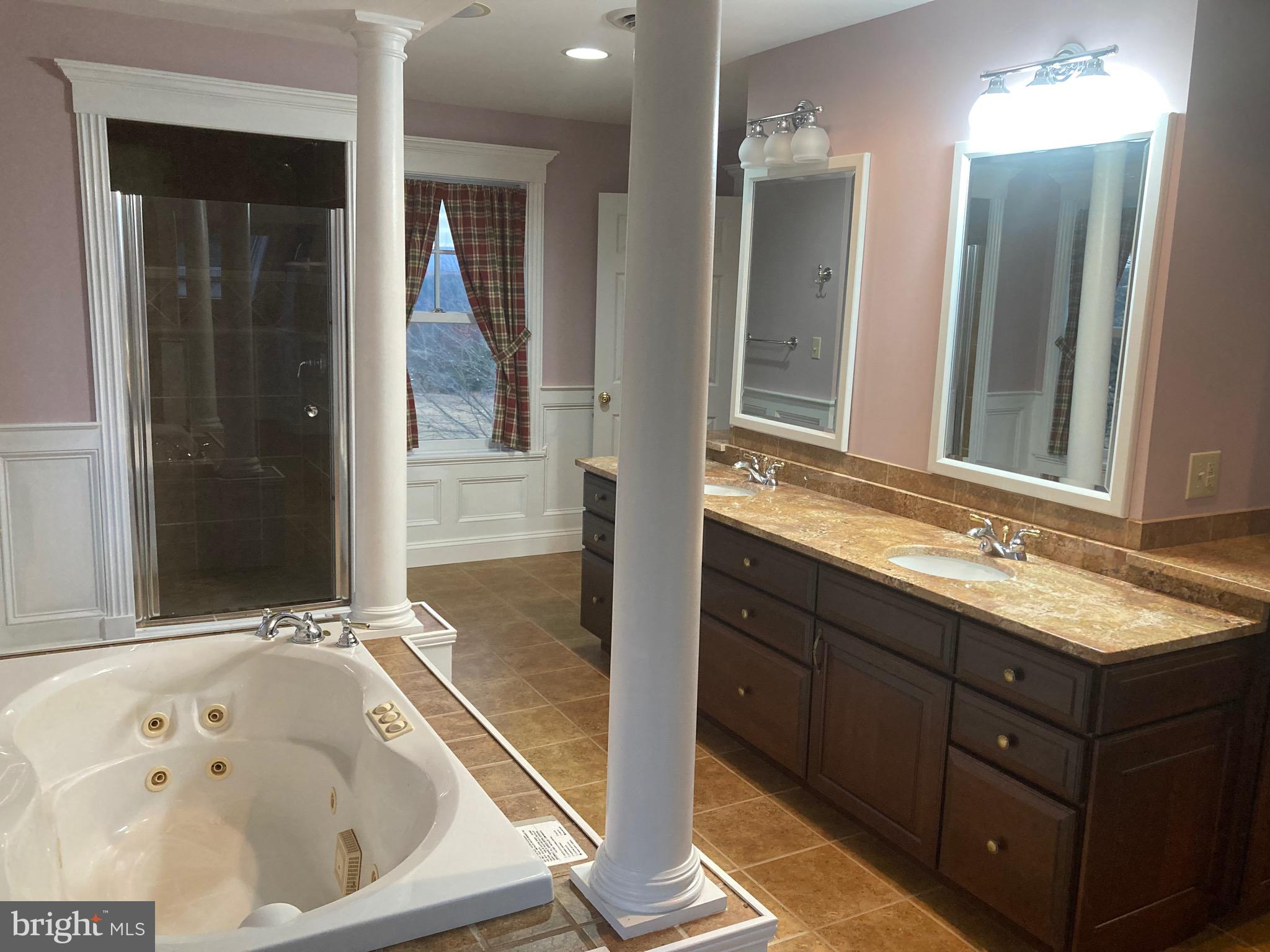 8124 Cromwell Church Road Hustontown, PA 17229 - Photo 26 of 61 a bathroom with a tub sink and mirror