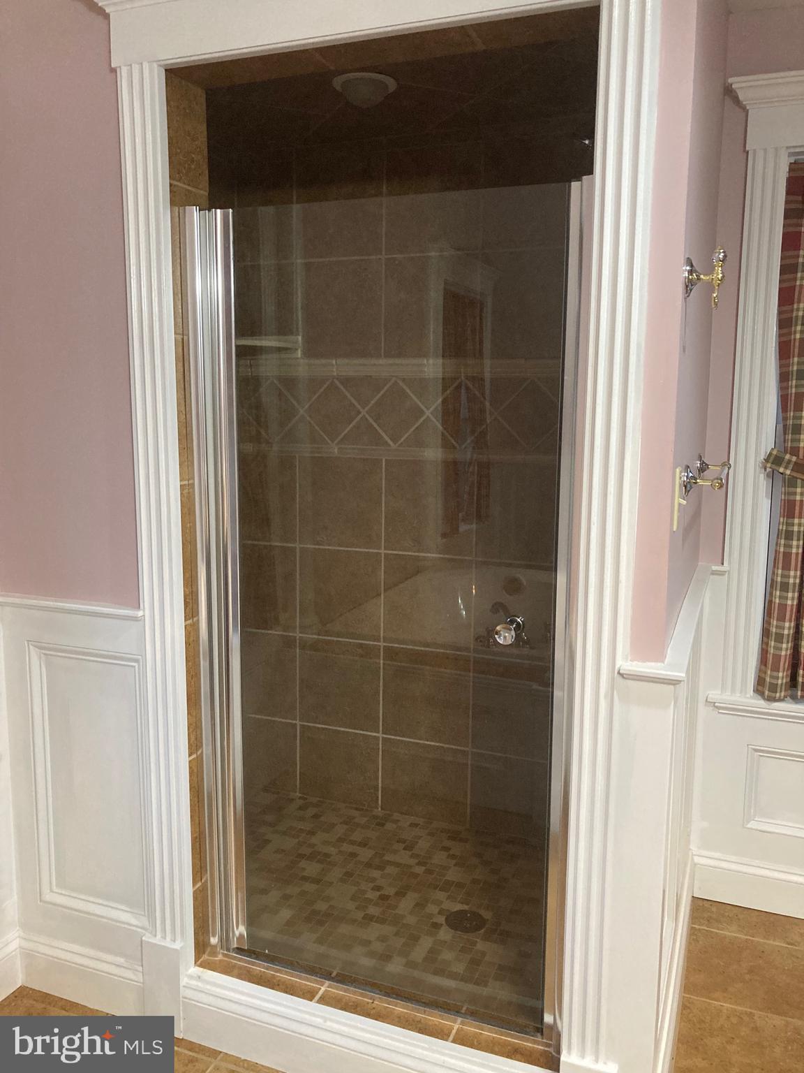 8124 Cromwell Church Road Hustontown, PA 17229 - Photo 27 of 61 a bathroom with a glass shower door