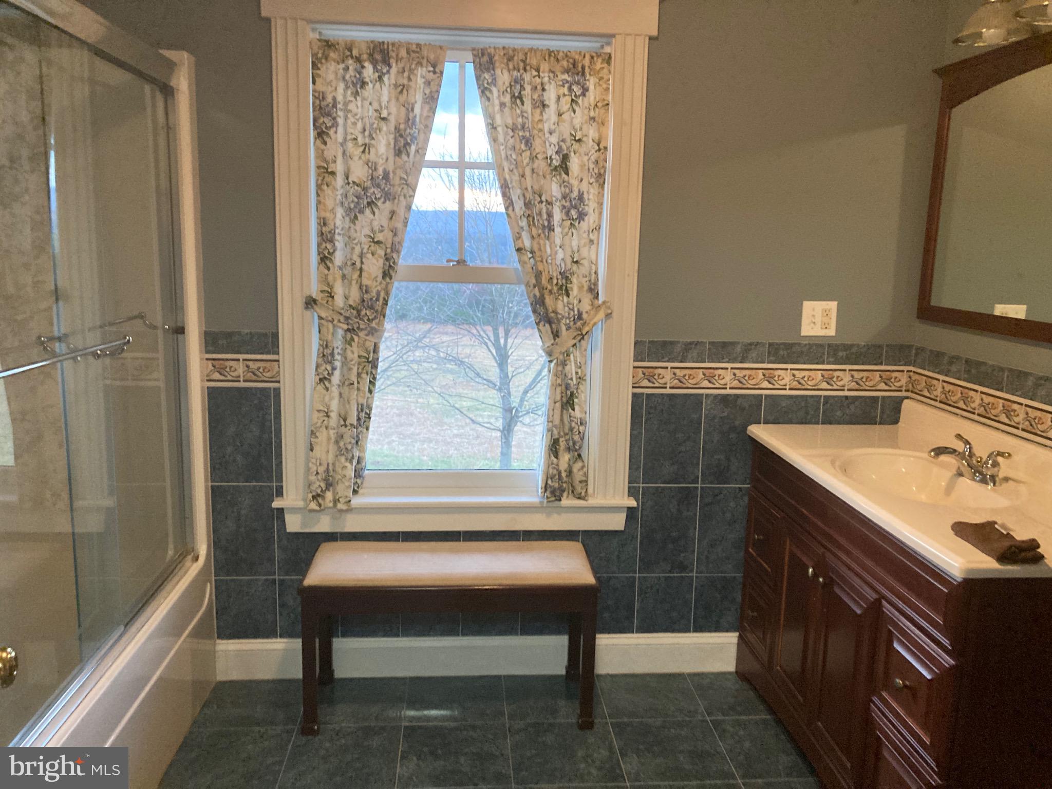 8124 Cromwell Church Road Hustontown, PA 17229 - Photo 32 of 61 a bathroom with a sink and a bathtub