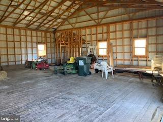 8124 Cromwell Church Road Hustontown, PA 17229 - Photo 56 of 61 a living room with furniture and a chandelier