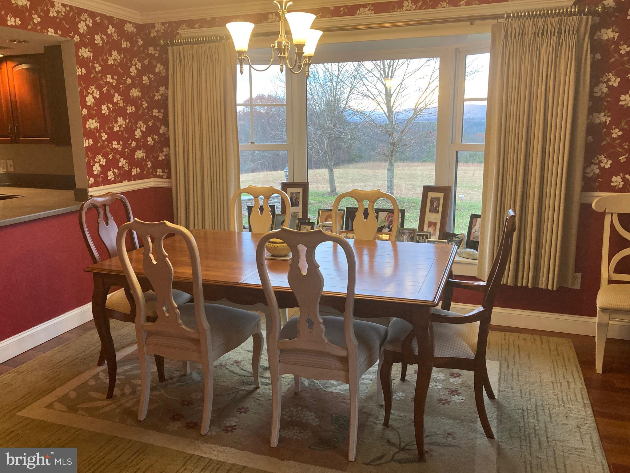 8124 Cromwell Church Road Hustontown, PA 17229 - Photo 9 of 61 a view of a dining room with furniture and wooden floor