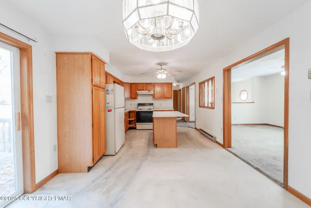 a view of a hallway with wooden walls