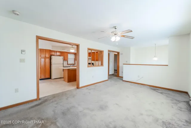 a view of a room with wooden walls