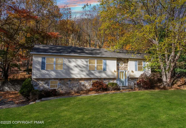 front view of a house with a yard