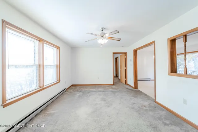 a view of a swimming pool with an outdoor seating