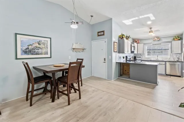 a view of a dining room with furniture and wooden floor