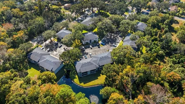 an aerial view of a house with a yard and a garden