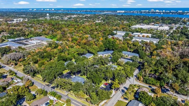 an aerial view of a houses with a yard