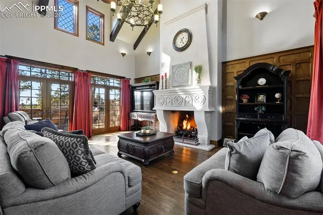 a living room with furniture fireplace and flat screen tv