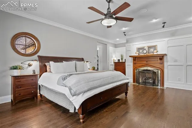 a bedroom with a bed and a fireplace