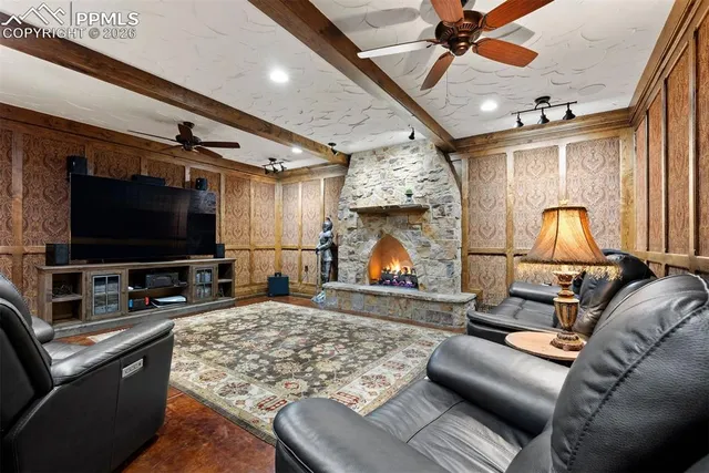 a room with pool table and windows