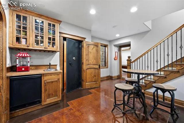 a view of a brick building with a bench in front of building