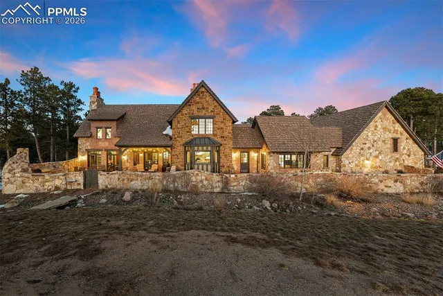 a view of a large house with a yard