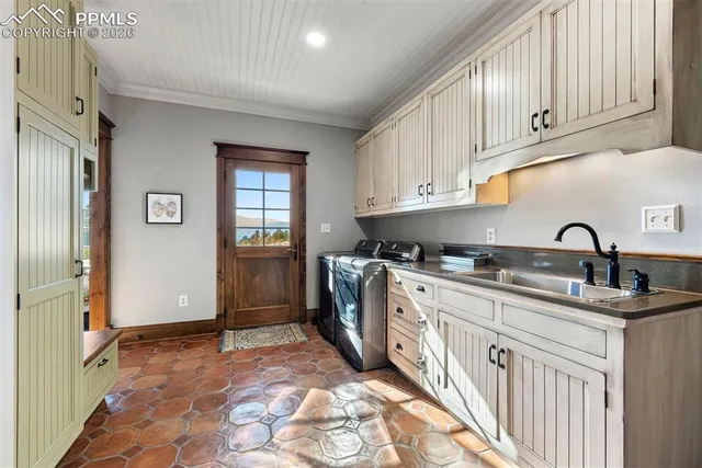 a living room with a baby crib furniture and a window