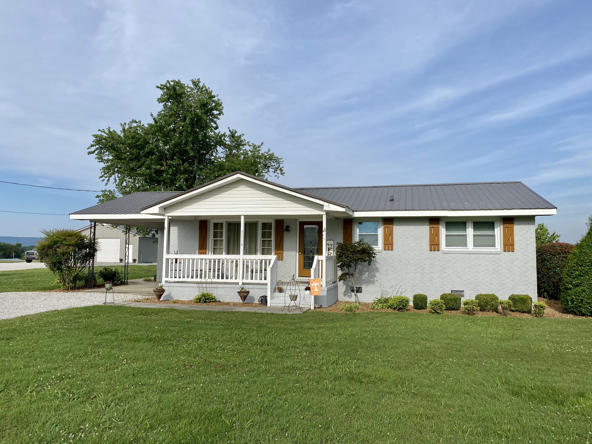 3216 Oak Grove Road Decherd, TN 37324 - Photo 1 of 27 a front view of a house with a yard