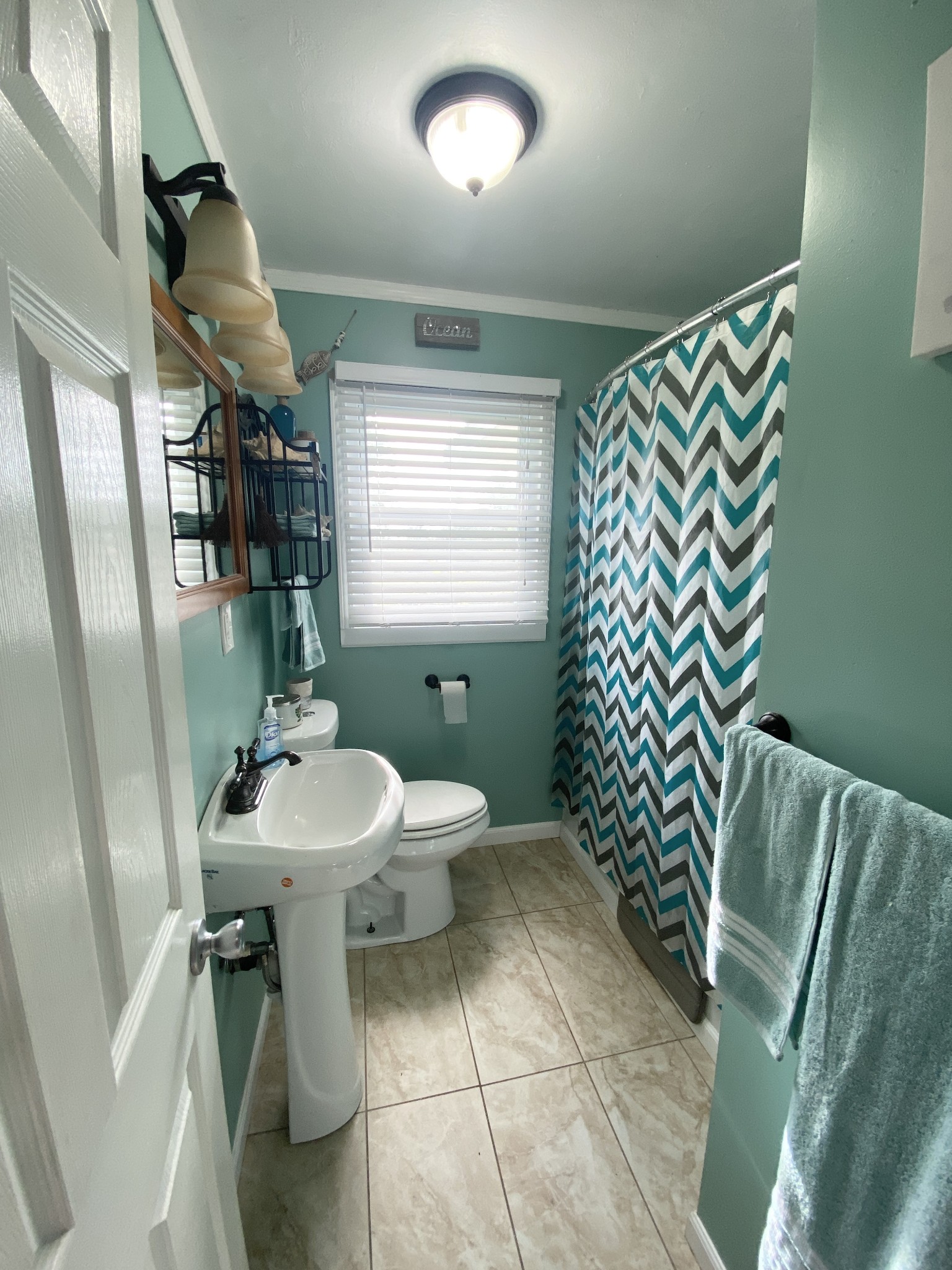 3216 Oak Grove Road Decherd, TN 37324 - Photo 14 of 27 a bathroom with a sink a toilet and mirror