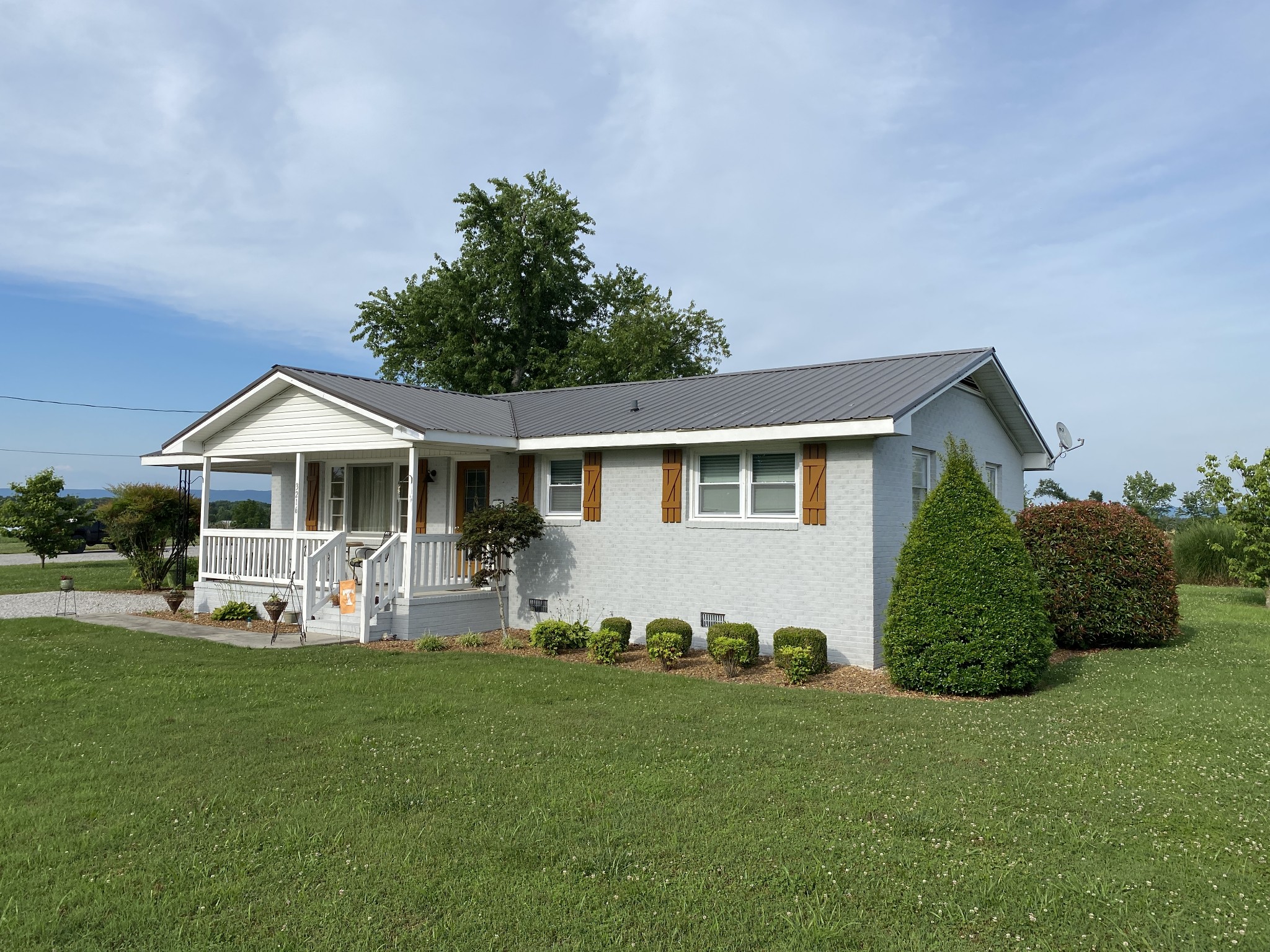 3216 Oak Grove Road Decherd, TN 37324 - Photo 3 of 27 a front view of a house with garden