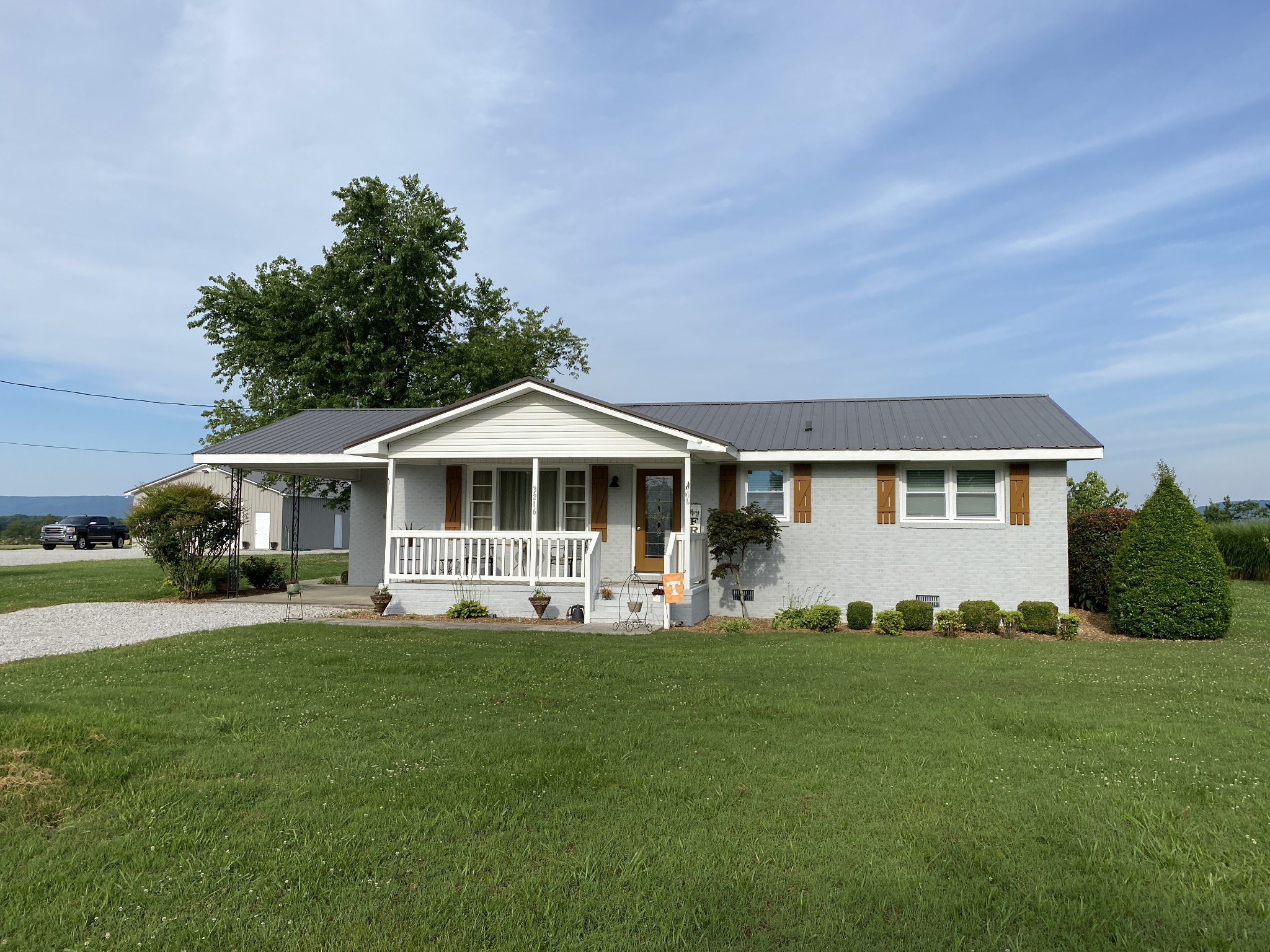 3216 Oak Grove Road Decherd, TN 37324 - Photo 22 of 27 a front view of a house with a yard