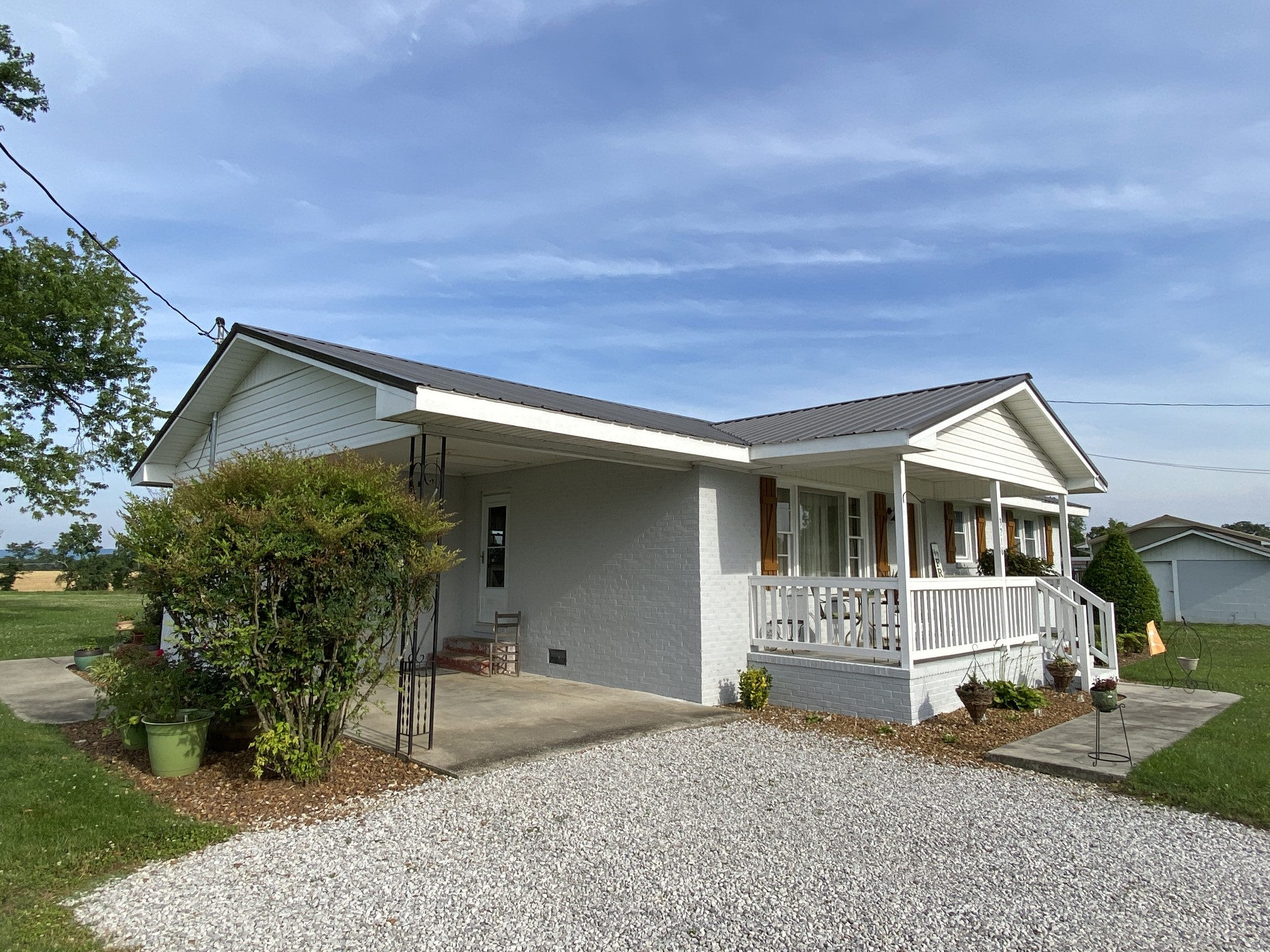 3216 Oak Grove Road Decherd, TN 37324 - Photo 5 of 27 a front view of a house with garden