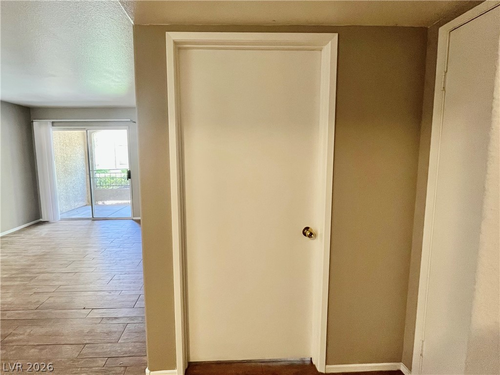 7885 West Flamingo Road, Unit 1029 Las Vegas, NV 89147 - Photo 10 of 18 Sliding doors invite outdoor views and abundant light into this inviting living space.