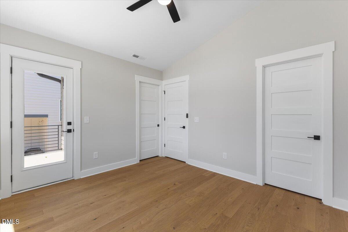 541 Bragg Street Raleigh, NC 27601 - Photo 30 of 44 a view of an empty room with window and wooden floor