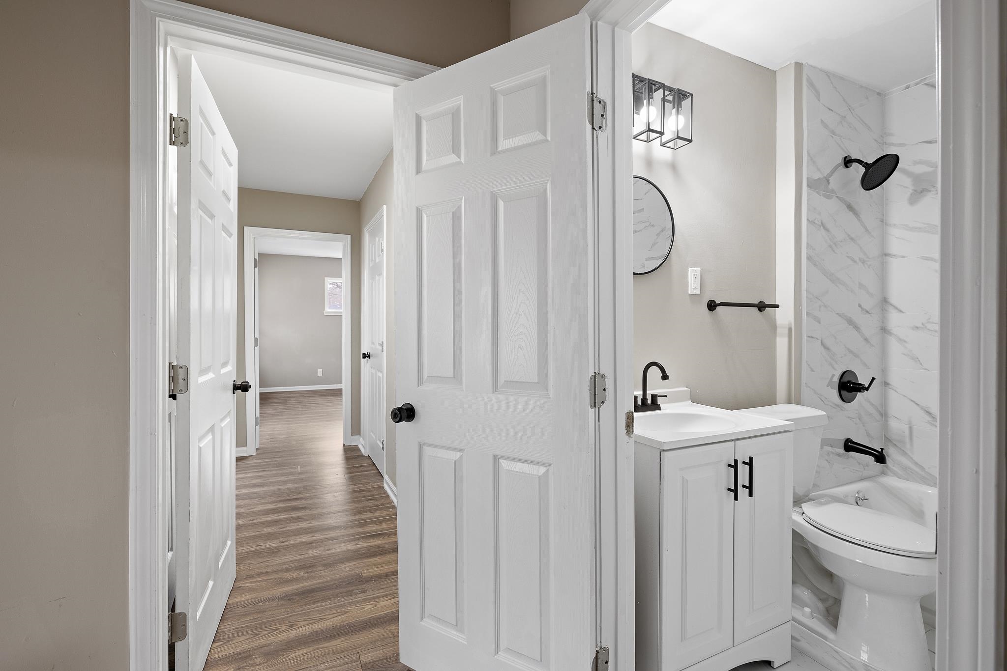 4375 Macon Road Memphis, TN 38122 - Photo 15 of 17 a bathroom with a sink a toilet and shower