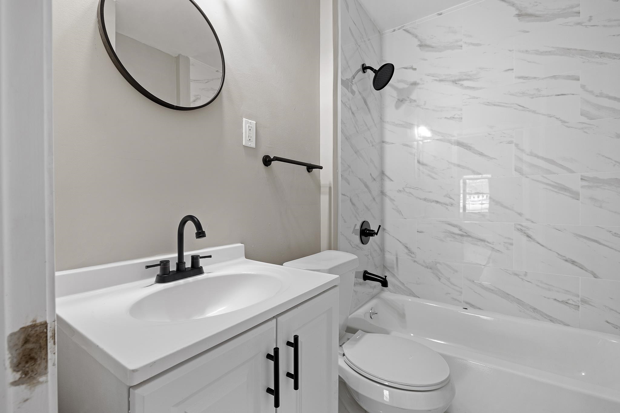 4375 Macon Road Memphis, TN 38122 - Photo 16 of 17 a bathroom with a sink a toilet and a mirror