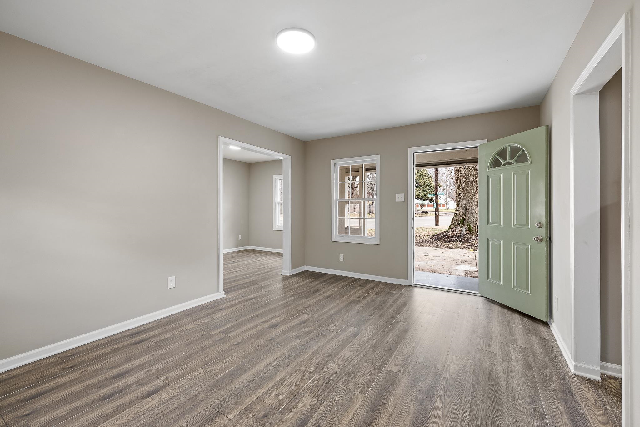 4375 Macon Road Memphis, TN 38122 - Photo 3 of 17 wooden floor in an empty room with a window