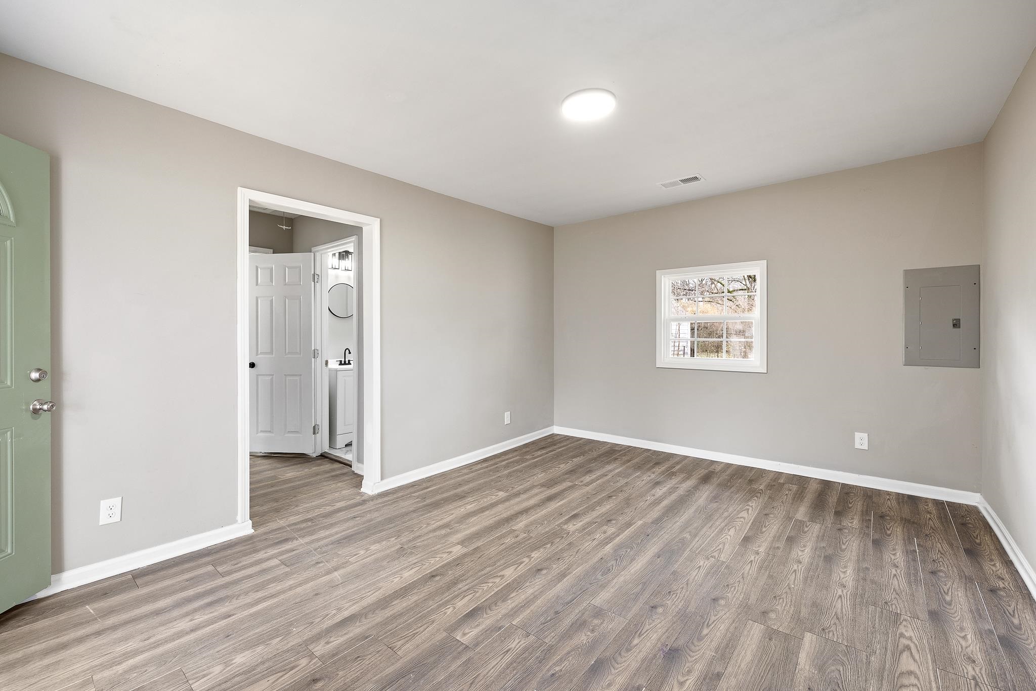 4375 Macon Road Memphis, TN 38122 - Photo 4 of 17 a view of an empty room with wooden floor