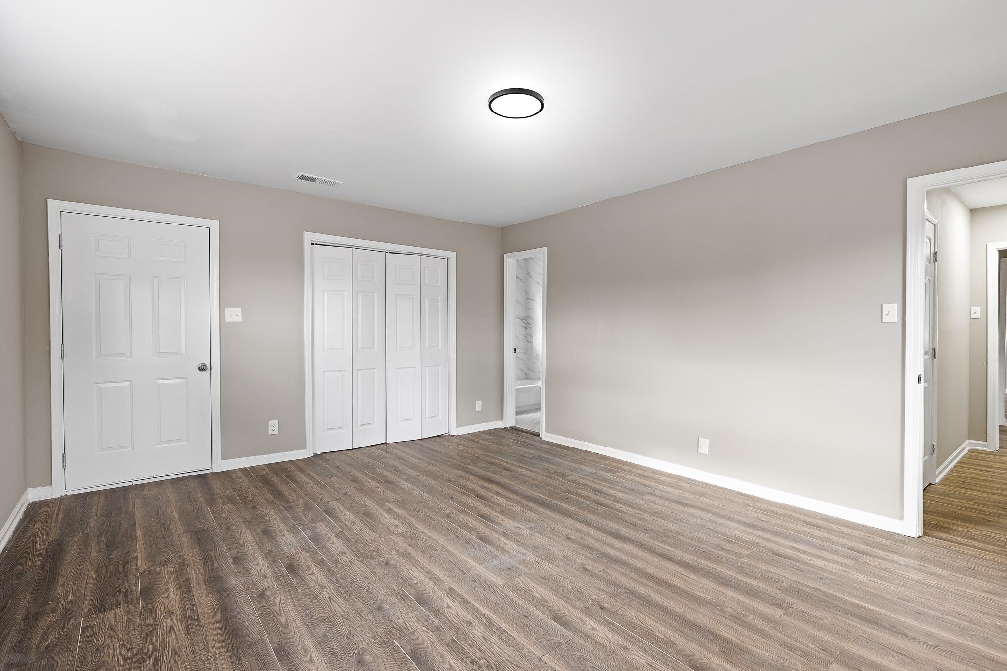 4375 Macon Road Memphis, TN 38122 - Photo 9 of 17 a view of an empty room with wooden floor