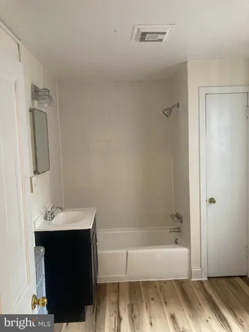 a bathroom with a sink and a bathtub