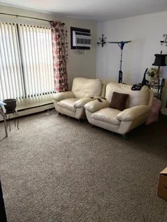 a bathroom with a glass door shower and a sink