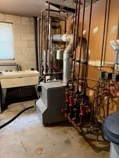 a view of gym equipment and a refrigerator