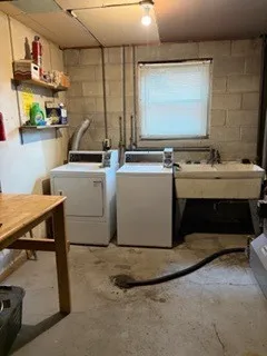 a room with stainless steel appliances lots of counter top space and furniture