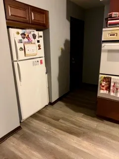 a view of washer and dryer with wooden floor